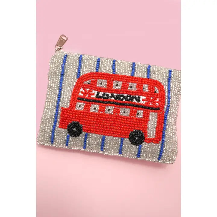 Purse with a beaded design of a red London bus on a pink background