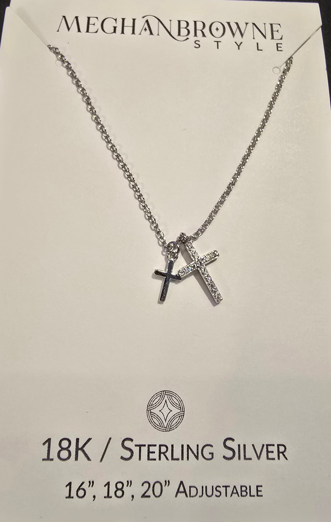 Silver necklace with cross pendant on a Meghan Browne Style card