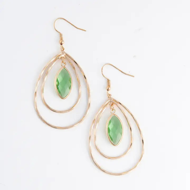 Gold and green teardrop earrings on a white background