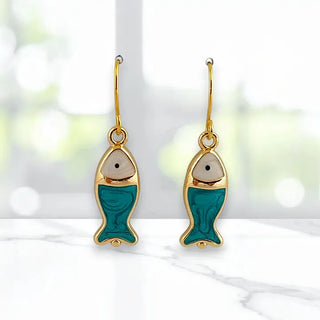 blue and white fish dangle earrings with gold accents