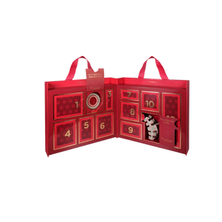 A red Advent calendar gift box with numbered doors and two handles, shown open on a plain white background.