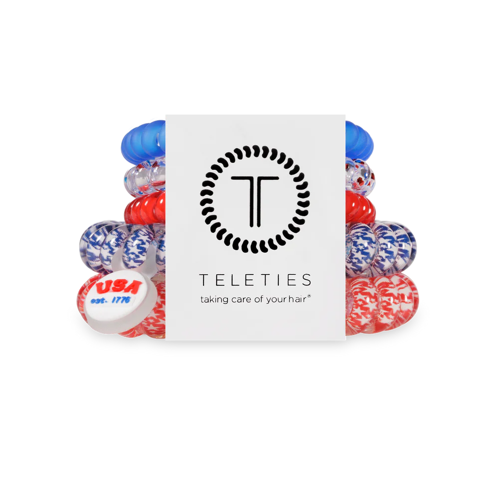 Set of red, white, and blue hair ties with Teleties packaging on a white background