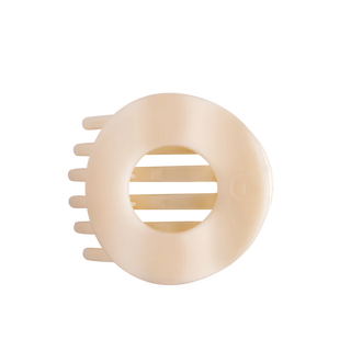 cream colored flat circle hair clip