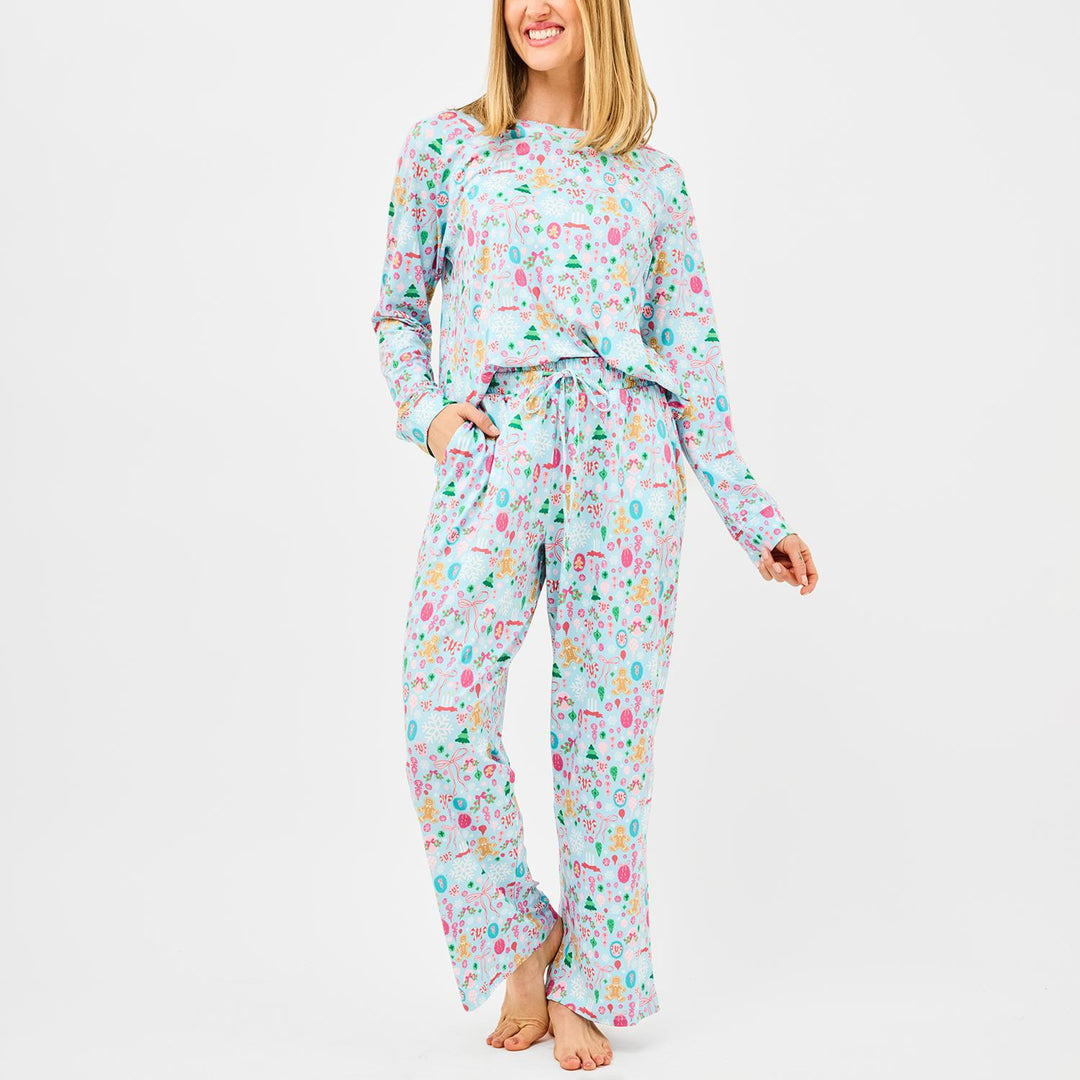 Woman wearing a colorful pajama set on a white background