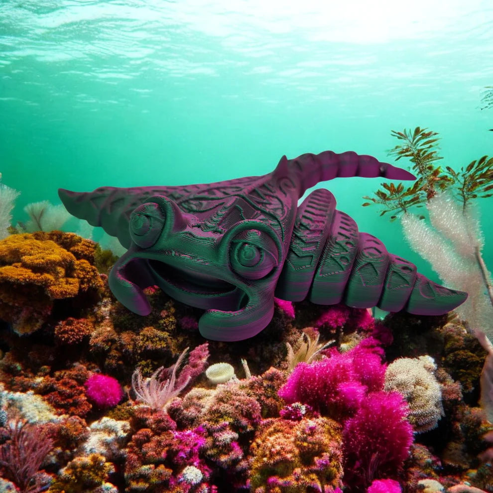 Purple sea creature among colorful coral and marine plants underwater