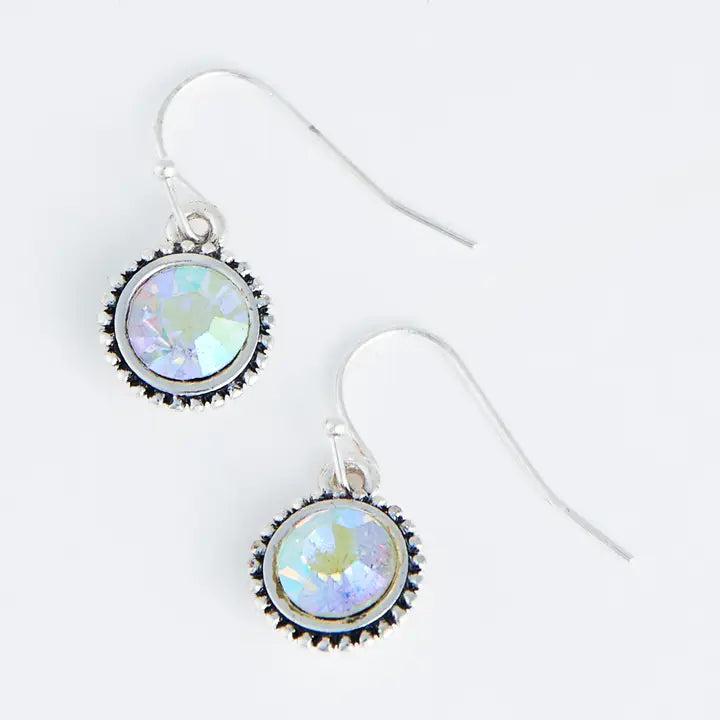Pair of earrings with round, iridescent stones on a white background