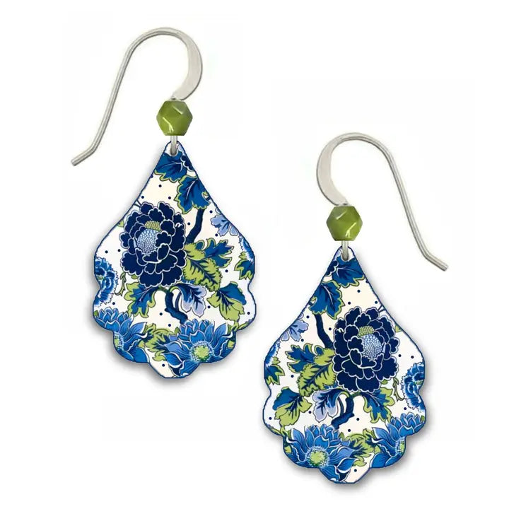 Pair of floral teardrop earrings with green beads on a white background