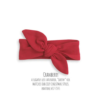 red tied bow headband on a white background