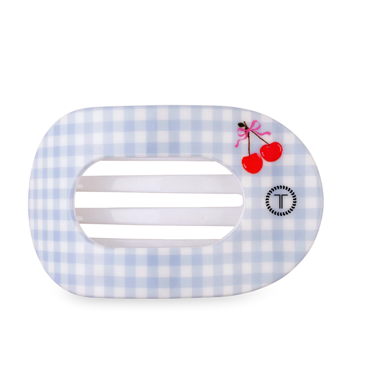 Hair clip with blue and white checkered pattern and cherry design on a white background