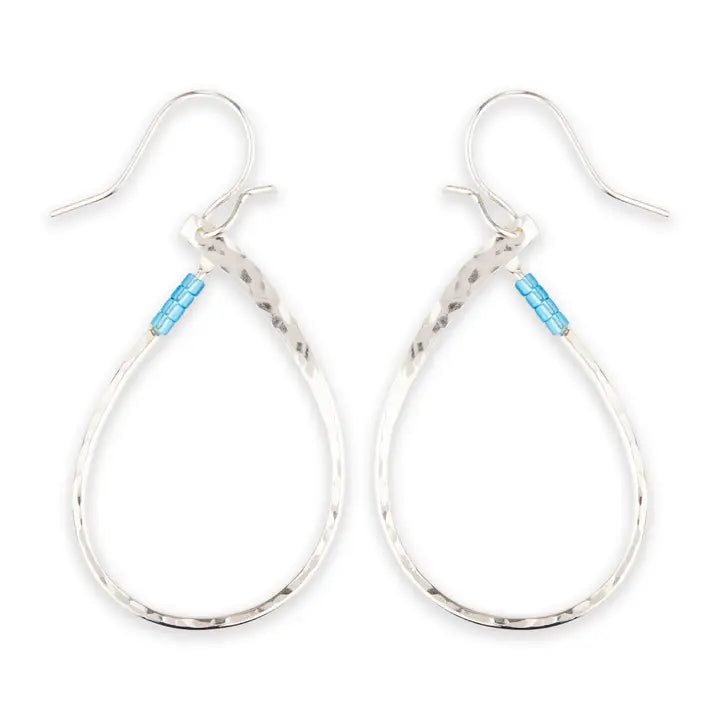 Silver hoop earrings with blue tag on a white background