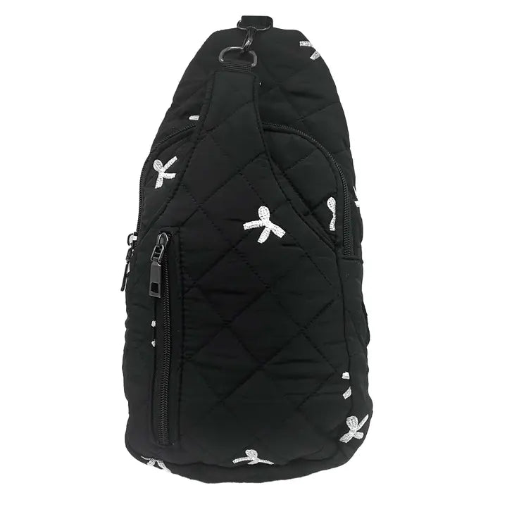 black quilted sling bag with white embroidered bows