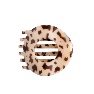 cream and brown colored circle hair flip