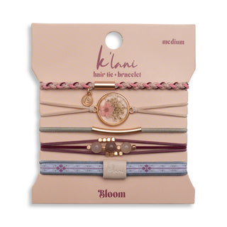 Packaged hair tie and bracelet set with 'ke'lani' branding on a beige background
