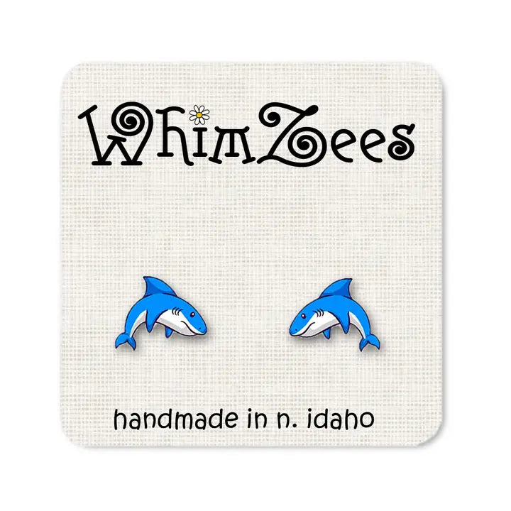 Blue shark earrings on a WhimZees branded card.