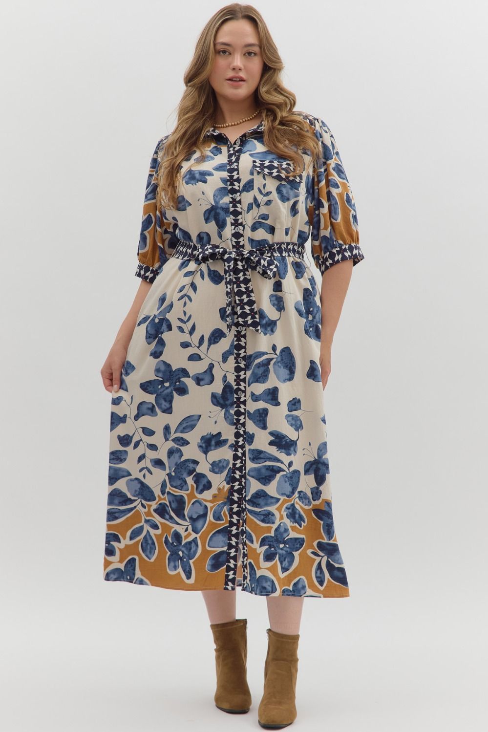 Woman wearing a floral dress with a white background