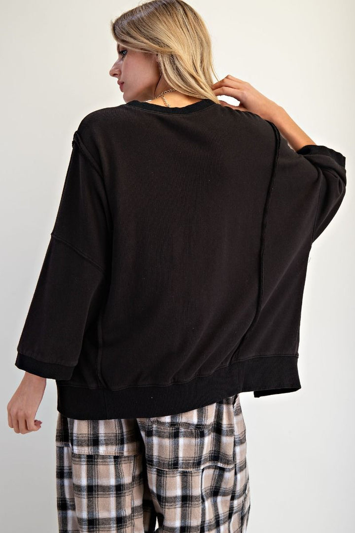 Bow Patch Hem Terry Pullover in Black
