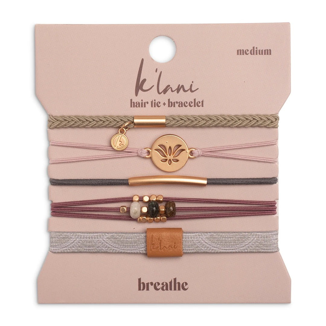 Set of hair ties and bracelets on a &