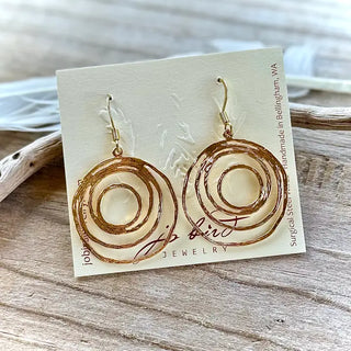 gold dangle earrings with geometric circle shaped charm