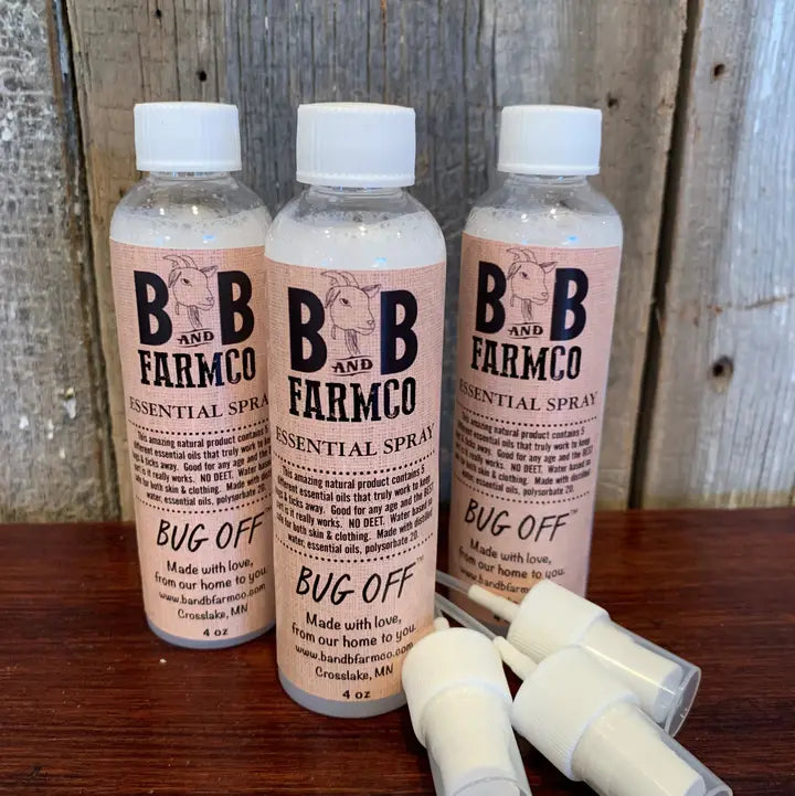 bug off essential oil spray on rustic background
