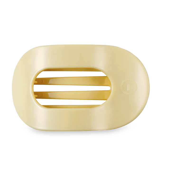 light yellow hair clip on a white background