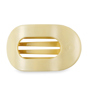 light yellow hair clip on a white background