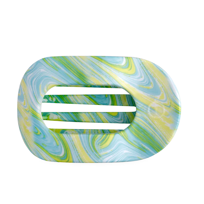 Marbled blue and green soap dish on a white background