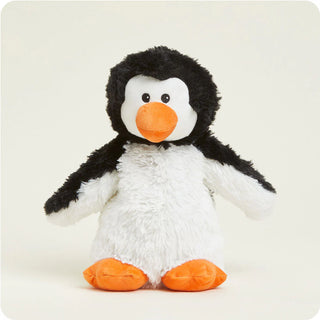 A plush toy penguin with black and white fur, an orange beak and feet, and a white belly.