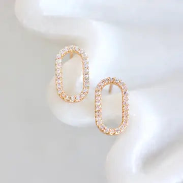 Pair of gold hoop earrings on a white background
