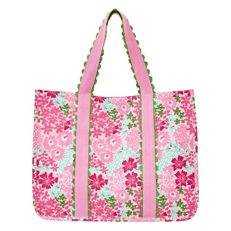 Floral patterned tote bag with pink straps on a white background