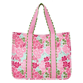 Floral patterned tote bag with pink straps on a white background