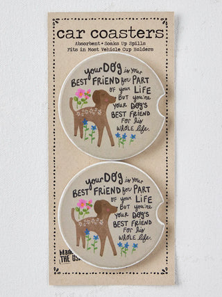 A package of two car coasters featuring a brown deer illustration, colorful flowers, and the text 'your DOG is your BEST FRIEND you PART of your LIFE but you're your DOG's BEST FRIEND for my WHOLE life.' on a beige textured background.