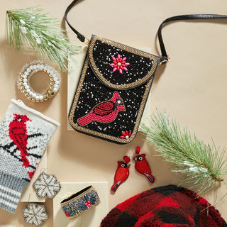 black leather crossbody with black and white beaded design, featuring a red cardinal in the center