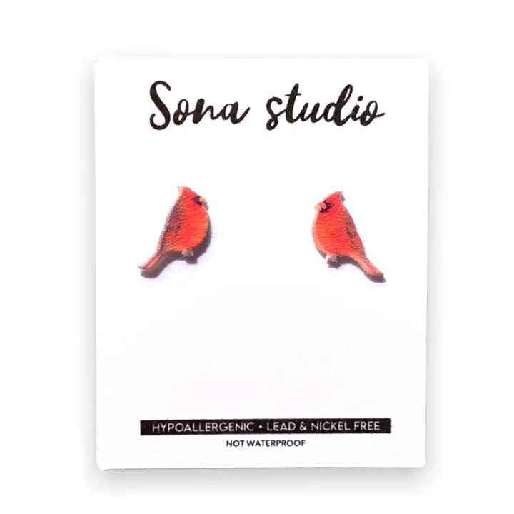 Cardinal bird earrings on a white card with 'Sona Studio' branding.