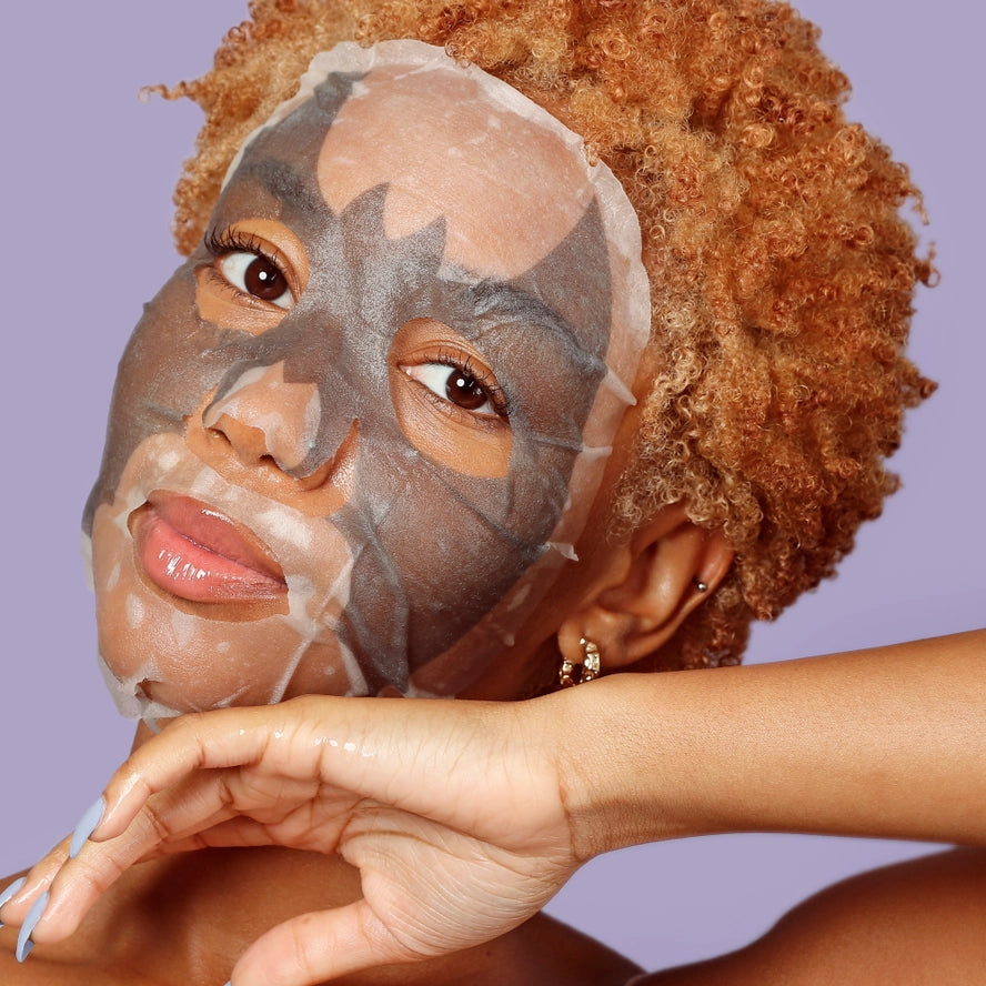 girl wearing a bat shaped face mask
