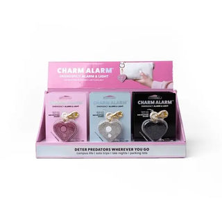 Display of charm alarms with packaging on a white background