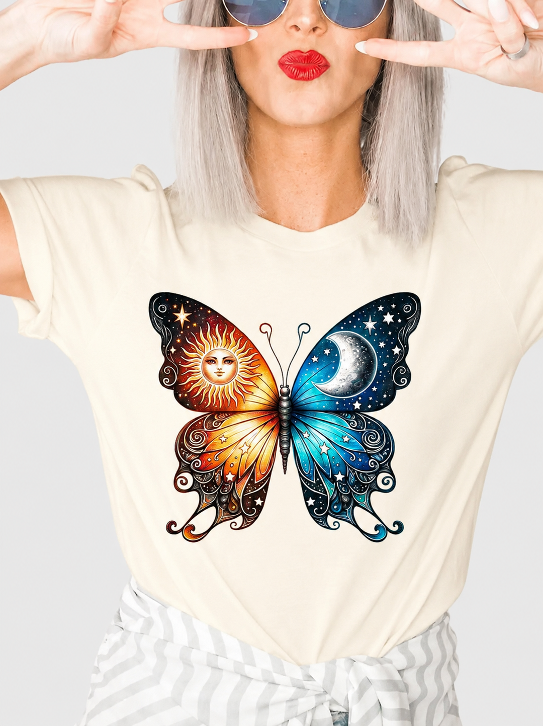 celestial butterfly on a cream colored tee
