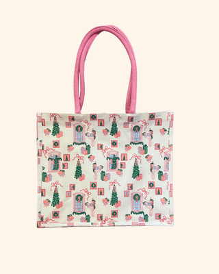 white bag with playful pink and green illustrations—featuring gifts, bows, and classic Christmas trees