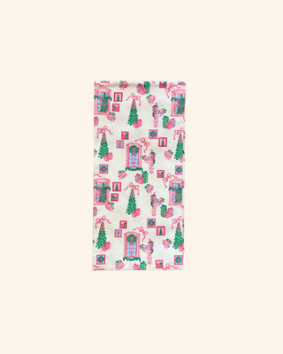 white towel Featuring playful illustrations of garlands, gifts, wreaths and ornaments in cheery pink and green