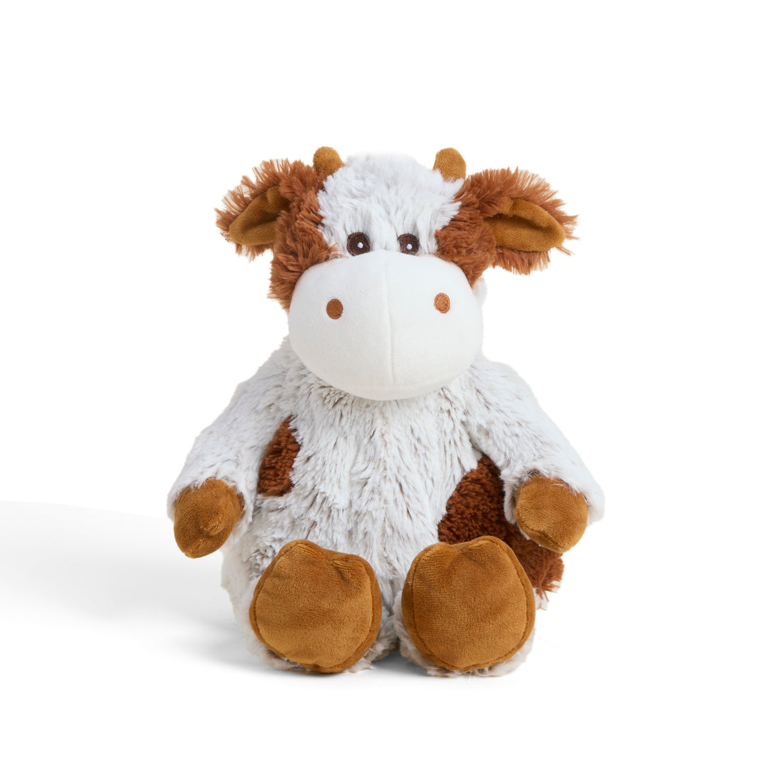Plush cow toy on a white background