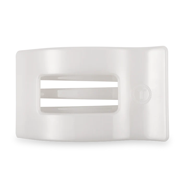 White flat rectangle hair clip on a white background