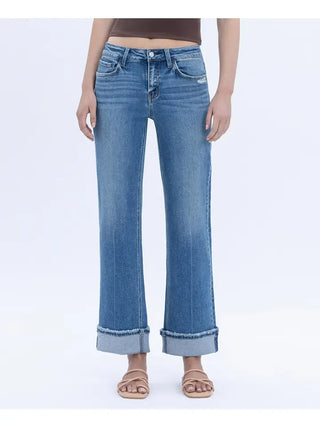 Person wearing blue jeans on a white background