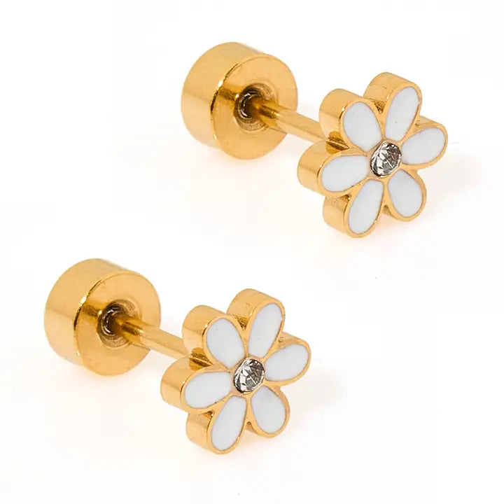 Gold flower-shaped earrings with white petals and clear gemstones on a white background