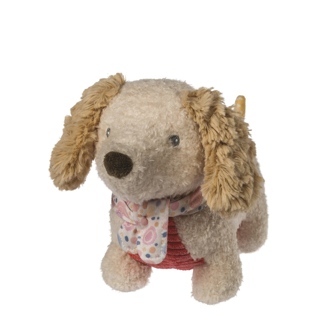 Stuffed dog toy with a floral scarf on a white background