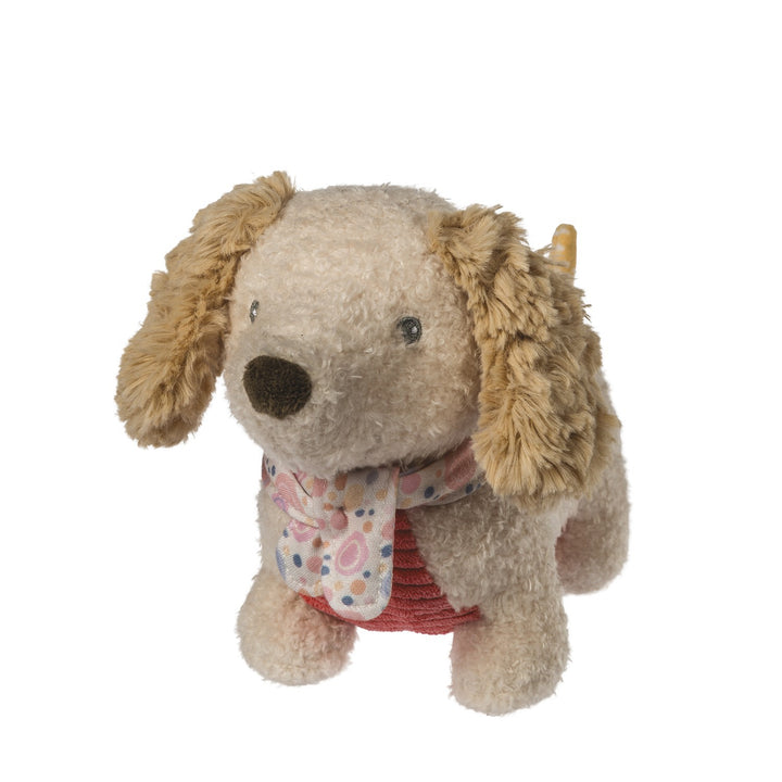 Stuffed dog toy with a floral scarf on a white background