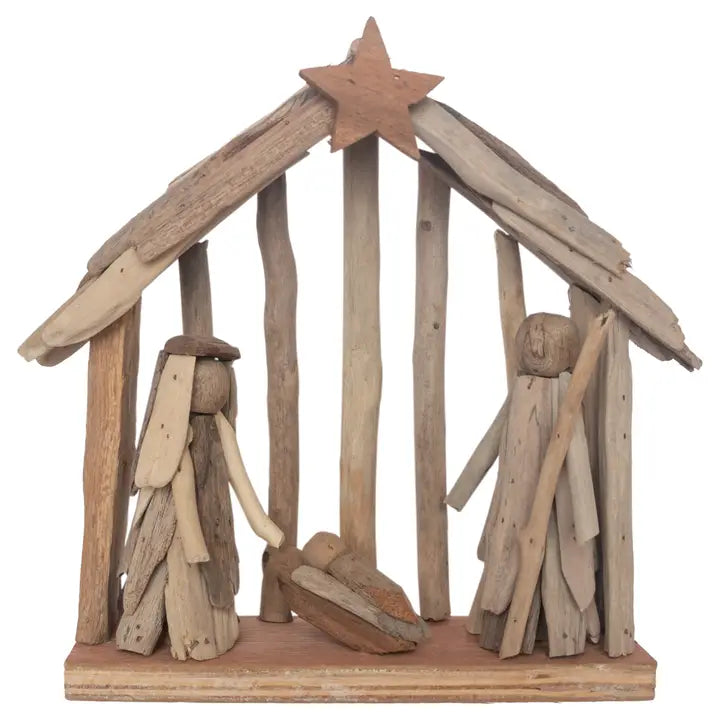 Wooden nativity scene with stable and figures on a white background