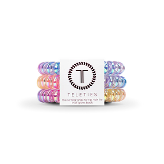 Set of colorful hair ties with a Teleties branded box on a white background