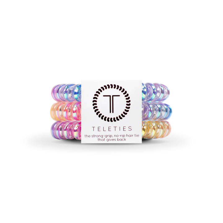 Set of colorful hair ties with a Teleties branded box on a white background