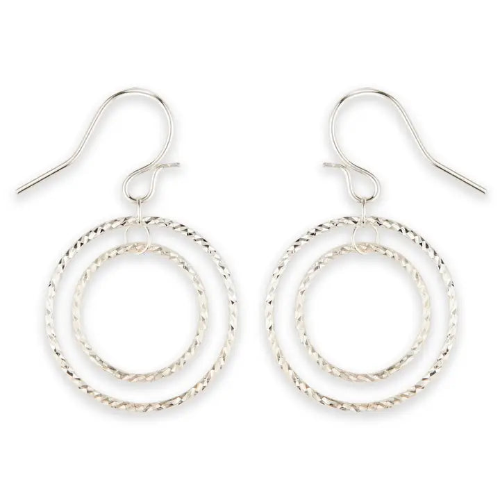 Silver hoop earrings on a white background