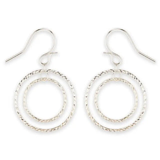 Silver hoop earrings on a white background