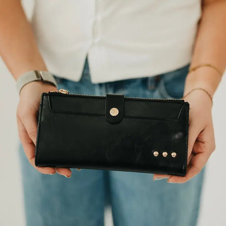 black leather wallet with gold hardware